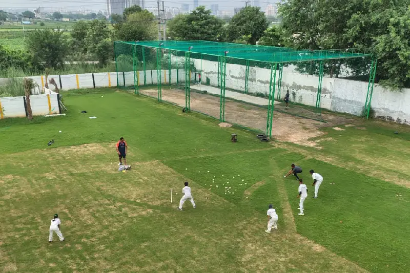 Complete cricket academy setup with practice nets and turf pitch by NK Contractors